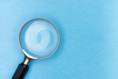 A magnifying glass to symbolise finding and assessing vulnerabilities in a company's IT infrastructure